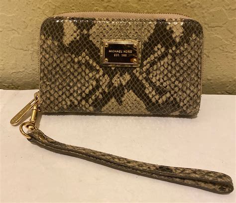 michael kors black snakeskin wristlet|Snakeskin Continental Wallet .